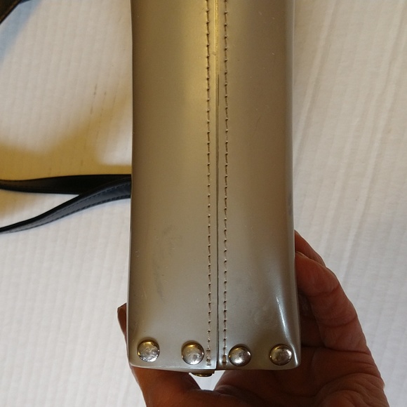 Beijo a pearlized gold color with black straps and trim. - Picture 10 of 14